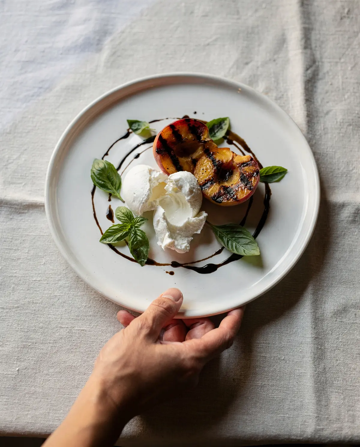 Burrata with grilled peaches and basil